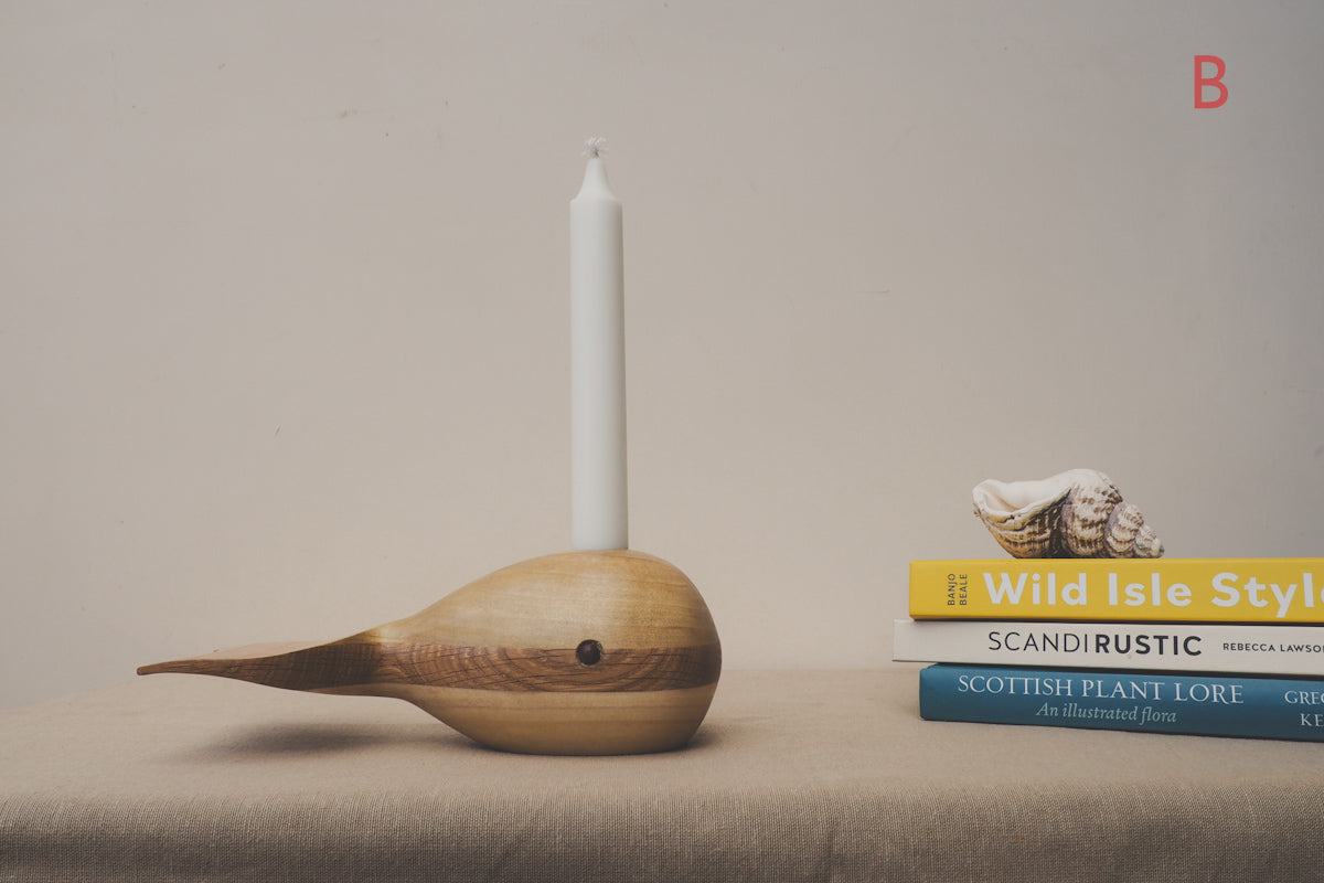 whale candle holder made from oak and tulip wood.