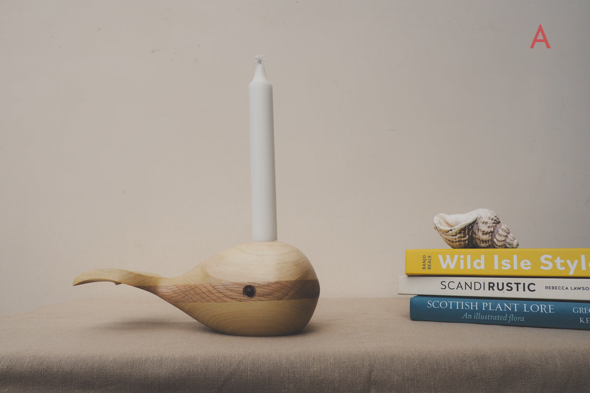 whale candle holder made from oak and tulip wood.