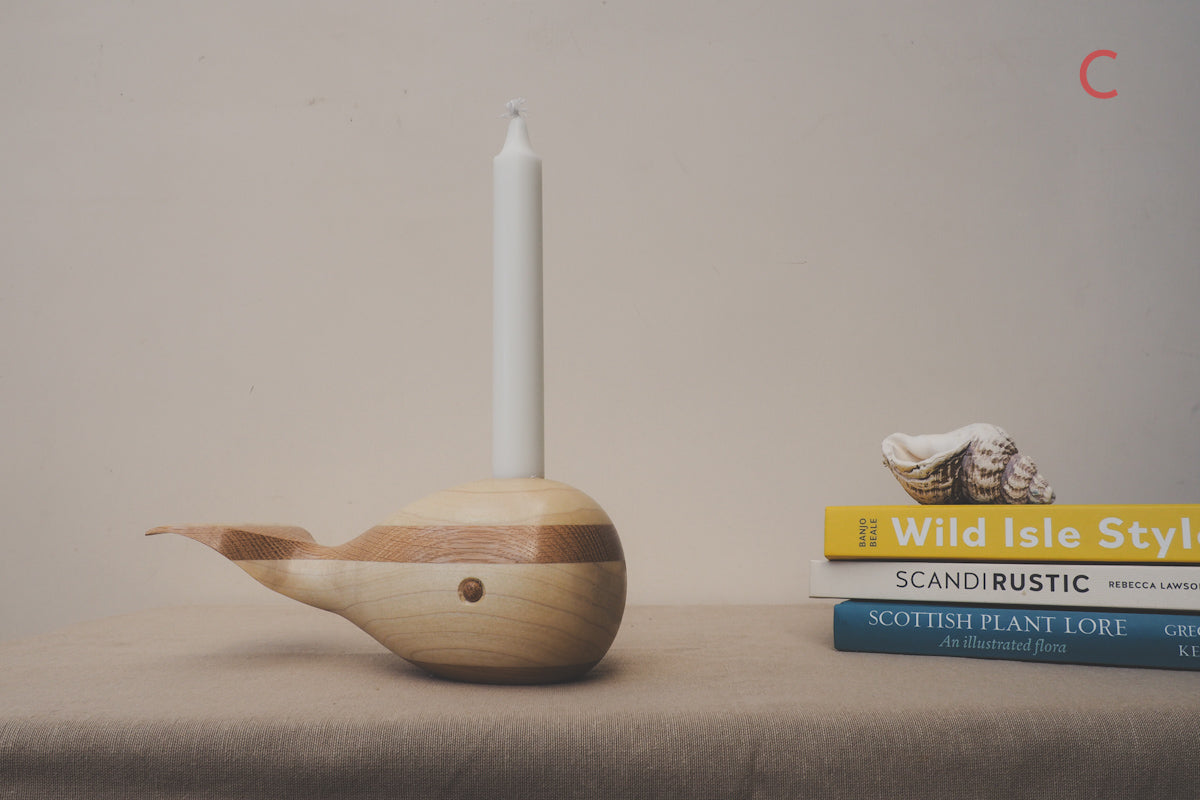 whale candle holder made from oak and tulip wood.