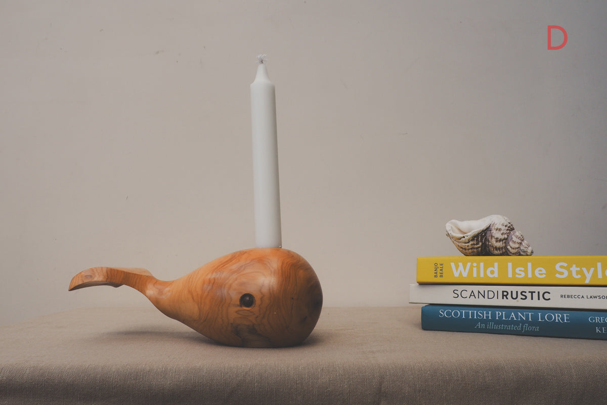 whale candle holder made from yew wood.